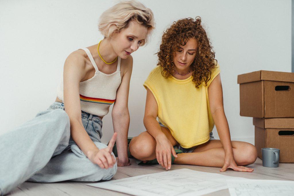Two women reviewing a escape routes for a house fire-safety drill