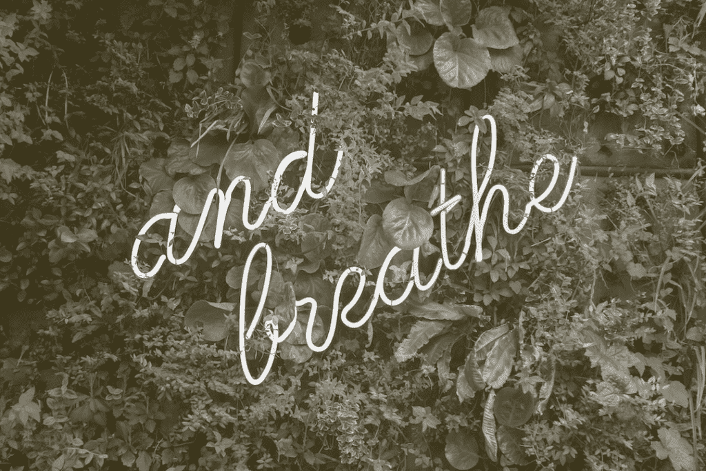 "and breathe" neon sign