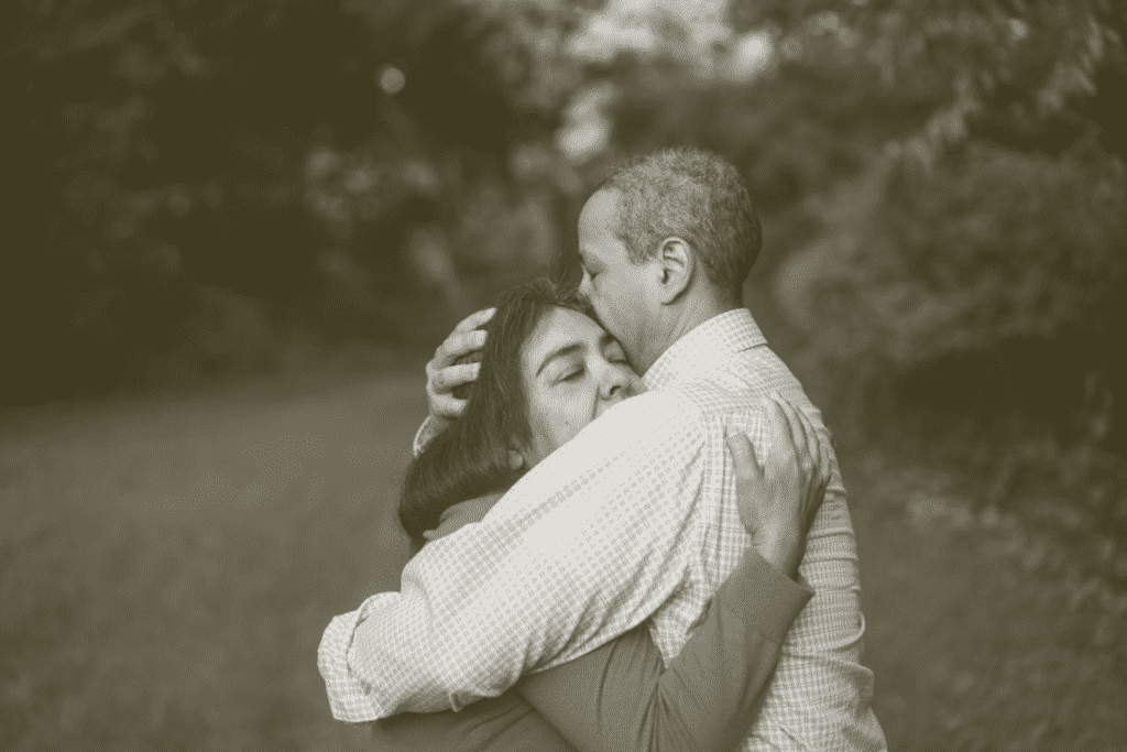 couple embracing, post tornado