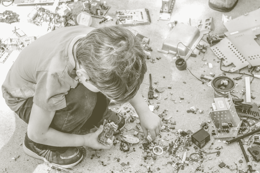 Child playing with metal scraps/apocalypse trash