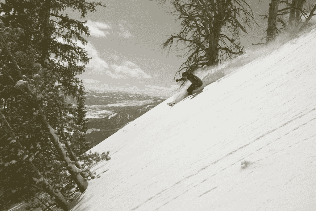 Skier skiing down a slope