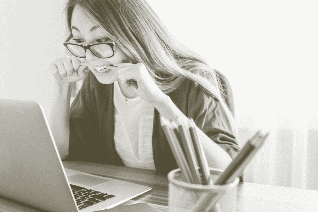 Stressed woman looking at her laptop