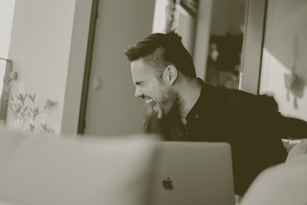 Man at his laptop excited by air purifiers