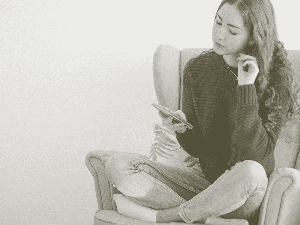 woman looking at her phone