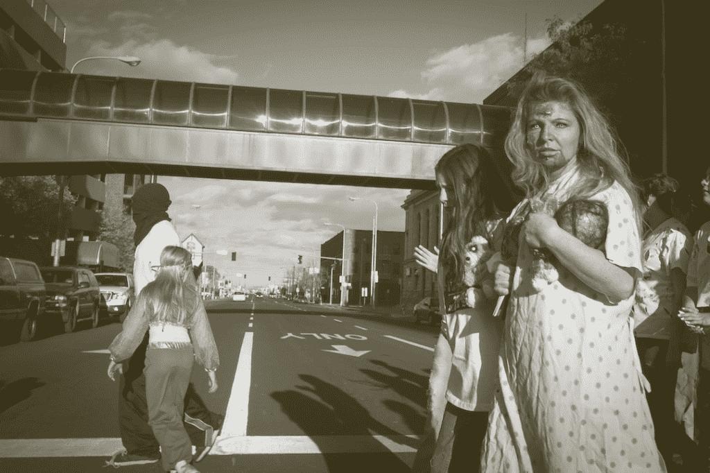 Zombies walking around a public street
