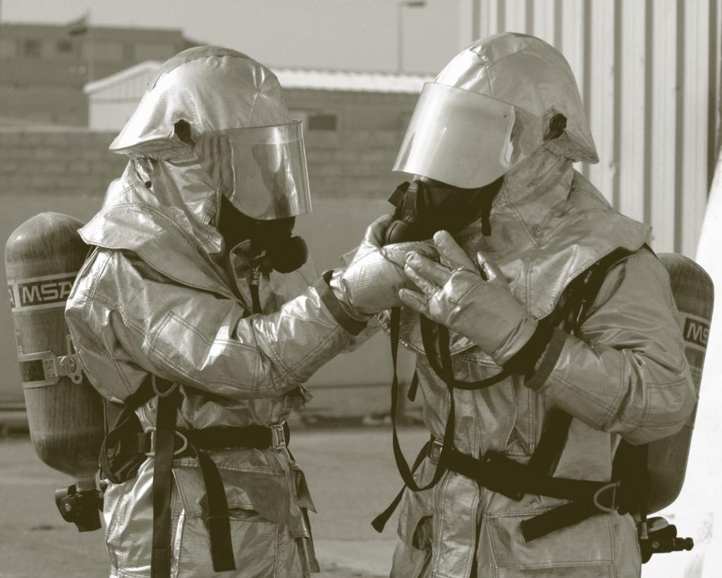 two people in hazmat suits