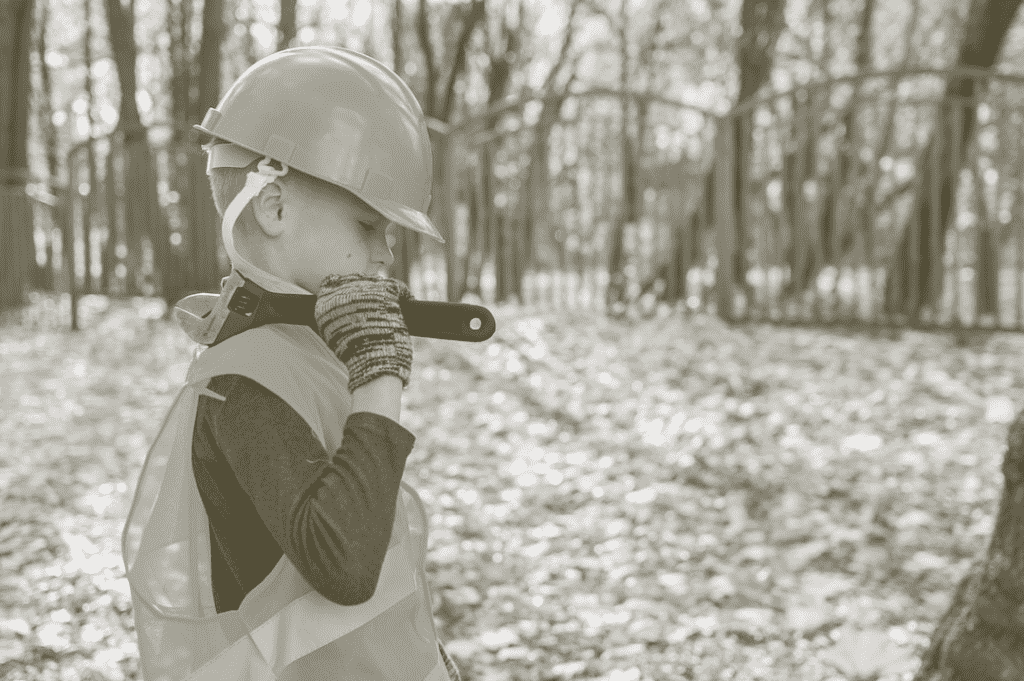 child with a wrench and construction gear